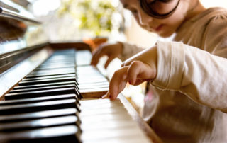 Kid playing piano in Music Rhapsody