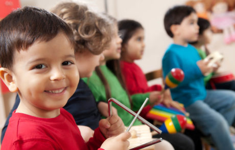 Children playing music in montessori classroom